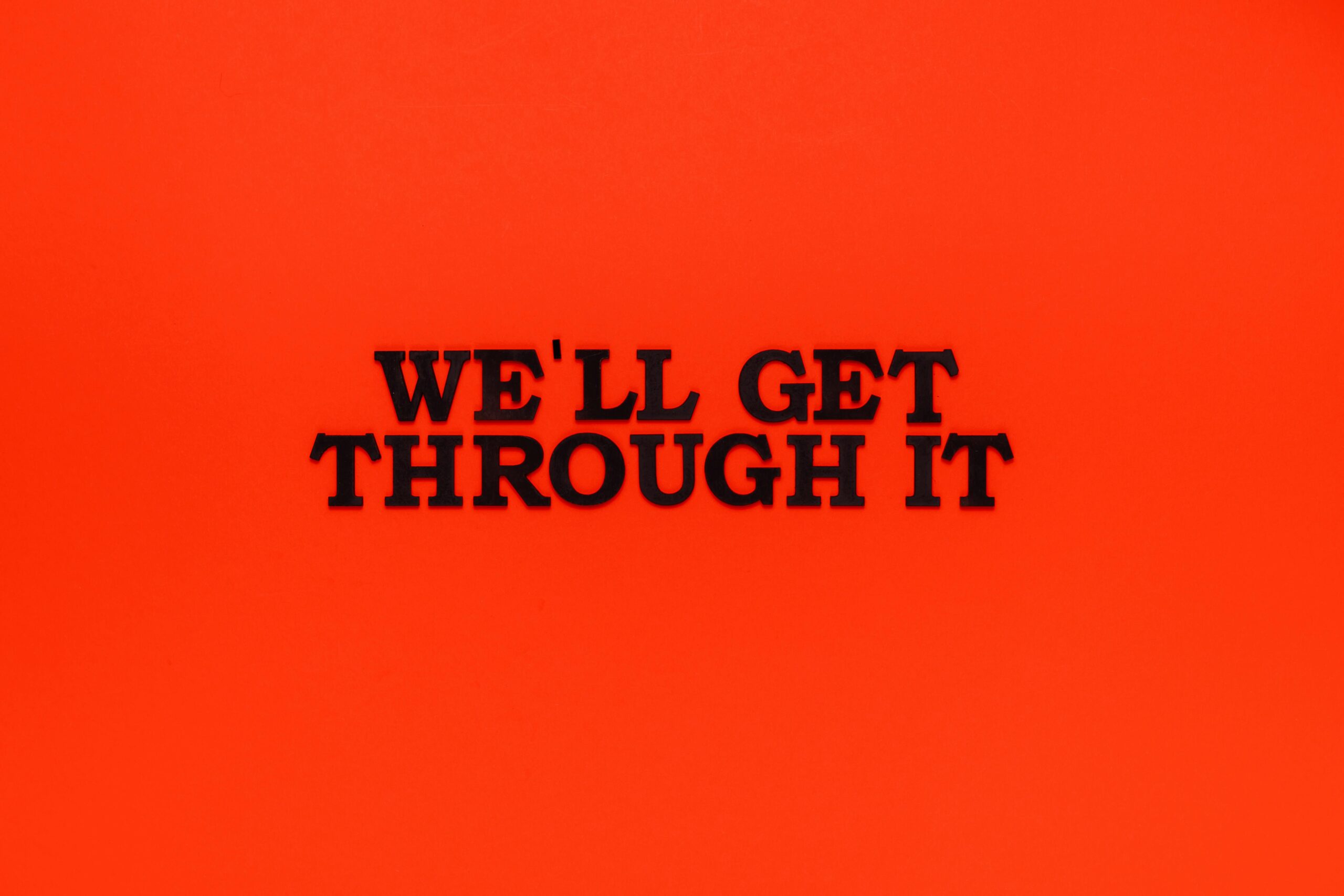 Motivational phrase on a bright red background to uplift and inspire.